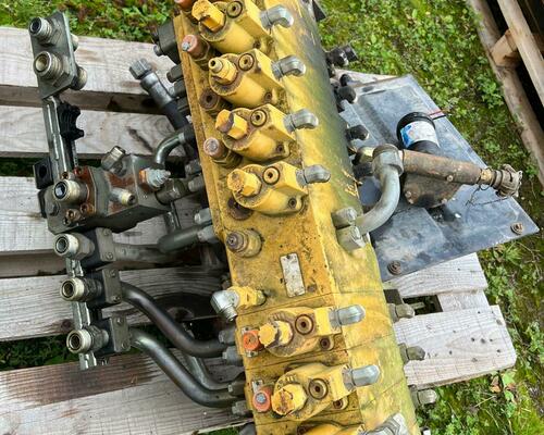 Náhradní díly na kolové rýpadlo CAT M 315