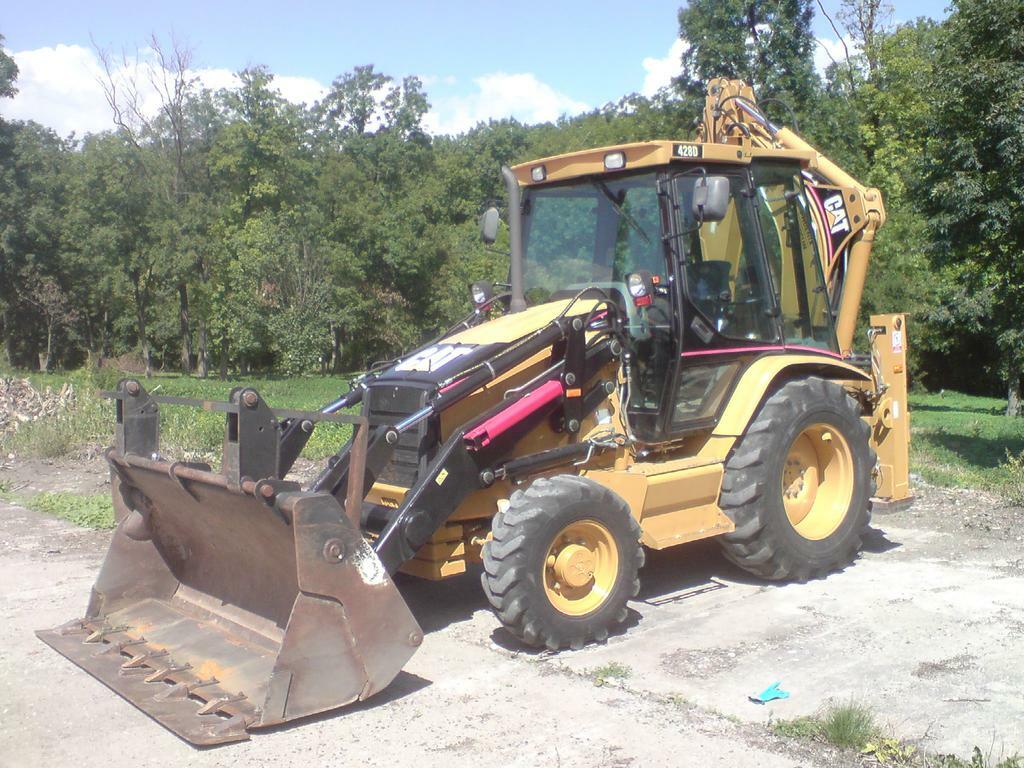 Re: Břit na traktorbagr Cat 428E
