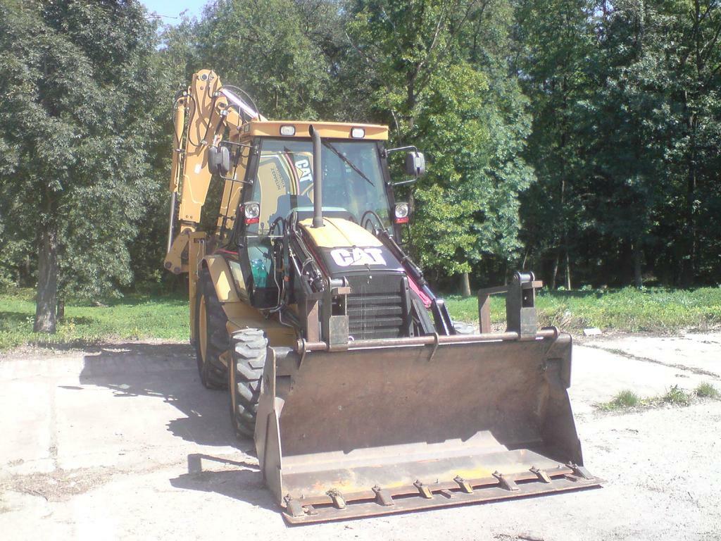 Re: Břit na traktorbagr Cat 428E