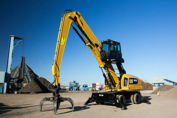 Překládkové rypadlo Caterpillar MH3027